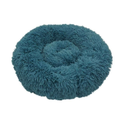 Cat curled up inside soft donut-shaped bed Calming Donut Bed for Dogs & Cats