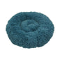 Cat curled up inside soft donut-shaped bed Calming Donut Bed for Dogs & Cats